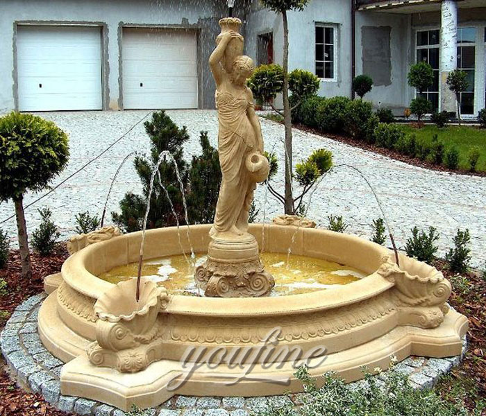 Indoor small beige marble water fountains with woman pouring water for hotel
