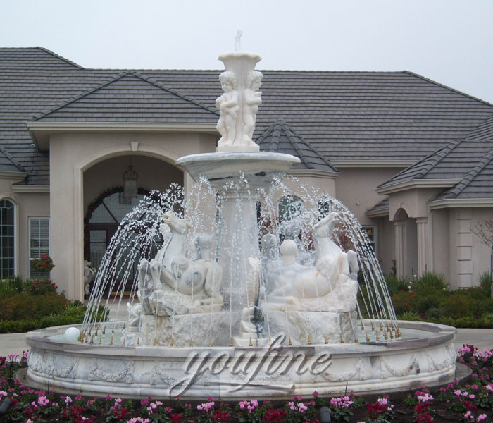 Outdoor grand Tiered stone horse fountain with cherub statues in the front of the hotel